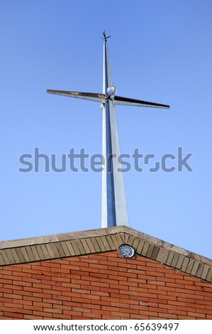 Modern Christian cross. Roof on the church and bell tower. He pointed roof with a modern appearance
Cathedral Sacred Heart College.[Exterior] Location Chiang Mai, Thailand.