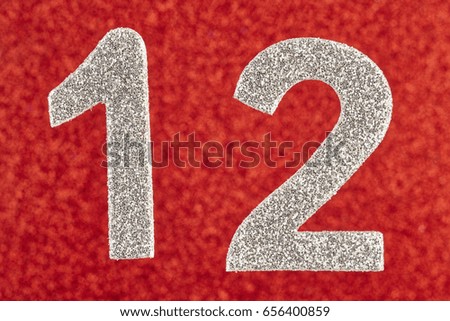 Number twelve silver color over a red background. Anniversary. Horizontal