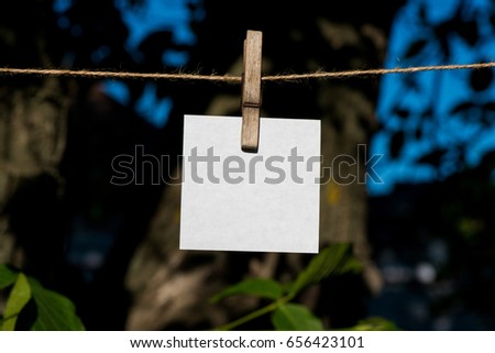 Rope with sheets of paper. Sheet of paper with a rope on the nature