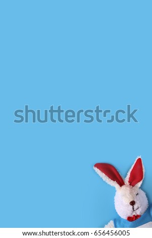 rabbit toy on blue background,Copy space,minimal style