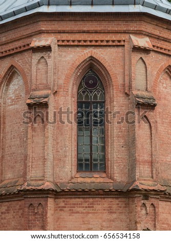 Window on the wall of a wooden or stone house or church