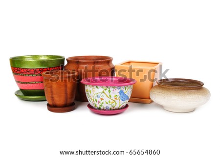 many different flowerpots in a line, isolated