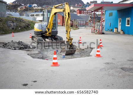Excavator loader or backhoe working on duty at road site digging moving and demolishing prepare for big project,selective focus.road fix by backhoe