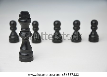 Abstract leadership business concept with chess pieces on a white background