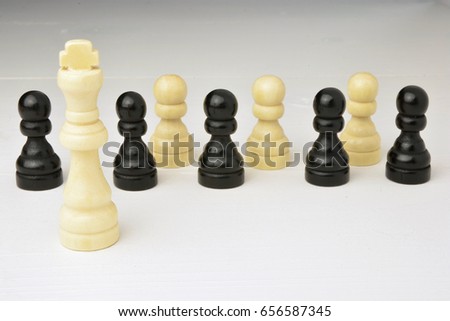 Abstract leadership business concept with chess pieces on a white background