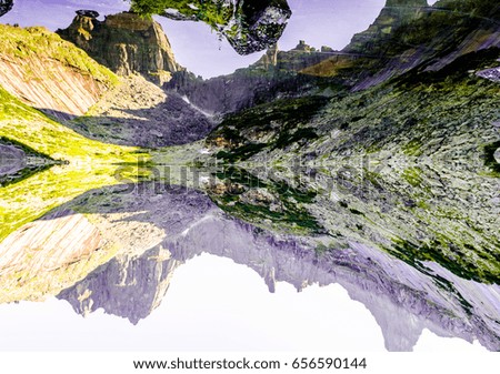 Mountains in the form of a timepiece. There is no difference between water and mountains.  Foto rotated to 180
