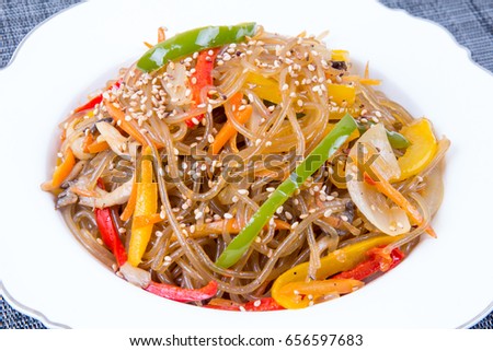 "Stir-fried Glass Noodles and Vegetables" (Japchae) - Korea Food Royalty-Free Stock Photo #656597683