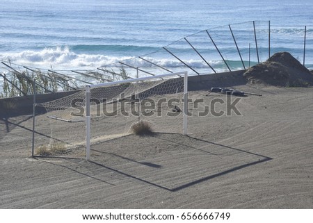 Football field in the ground on the sea