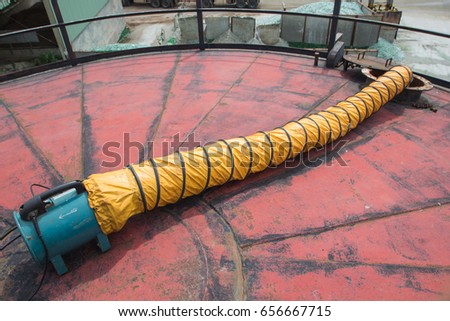 Blower fresh air into oil storage tank confined space