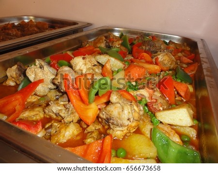 chicken afritadda, Philippine cuisine
Chicken afritada is a popular favorite dish in the Philippines where chicken pieces are cooked in tomato sauce with potatoes, carrots, bell peppers, and peas 
