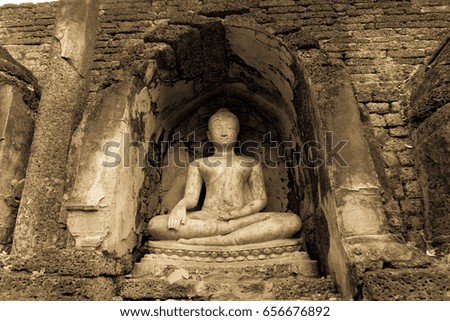 buddha meditation statue and pagoda in sukhothai historical park