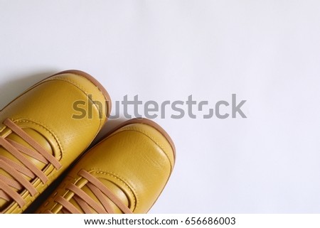 yellow shoes on white background