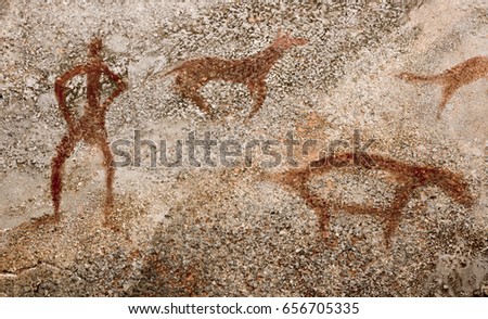 Drawings on the wall of the cave, from ocher. Scenes of hunting for ancient animals. Prehistoric man, Stone Age, ice age.