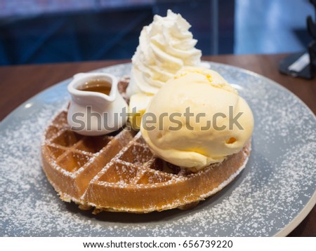 waffle and ice-cream with chocolate sauce Royalty-Free Stock Photo #656739220