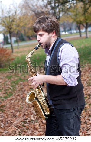 Man playing on saxophone in the park