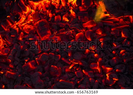 Burning firewood in the fireplace close up, BBQ fire, charcoal background