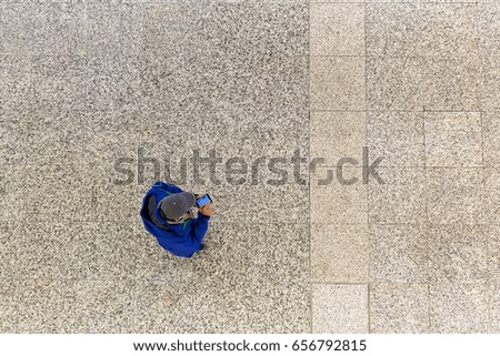 picture of a man with phone seen from above