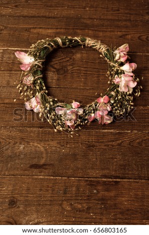 Wreath of grass with flowers on a dervish table