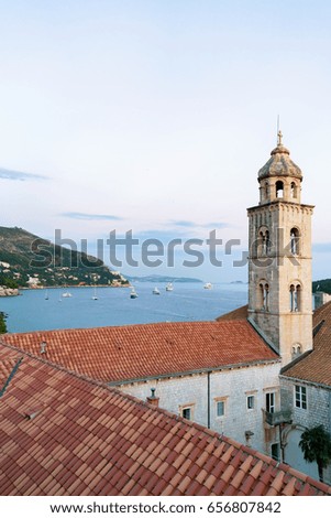 Dominican monastery belfry and Adriatic Sea, Dubrovnik late in the evening, in Croatia