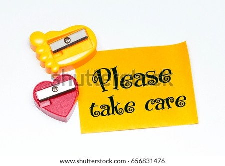 concept image of two sharpener/stick note and word - Please take care with isolated white background/selective focus.