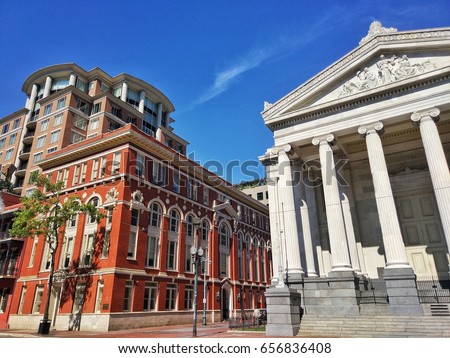 Gallier Hall and Louisiana Bar Associates on St Charles Ave near the Lafayette Square with beautiful blue sky