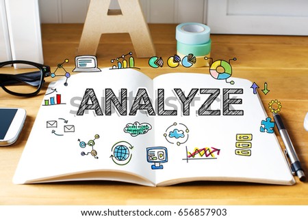 Analyze concept with notebook on wooden desk 