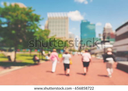 Abstract blurred people walking at the Inner harbor of Baltimore, Maryland