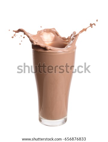 Chocolate milk splash out of glass., Isolated on white background. Royalty-Free Stock Photo #656876833