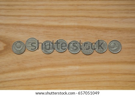 Old soviet coins on a wooden background. Historic, used currency.