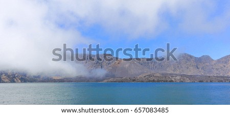 Scenery of lake and Baru volcano inside Rinjani mountain, active volcano at Lombok island of Indonesia.