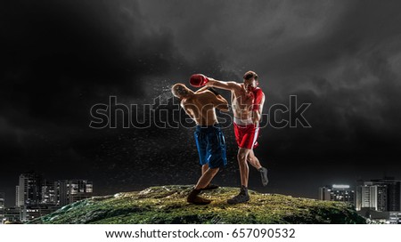 Box fighters trainning outdoor . Mixed media