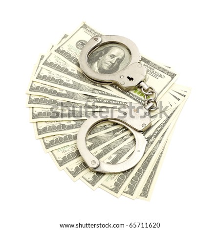Handcuffs on money background, business security concept