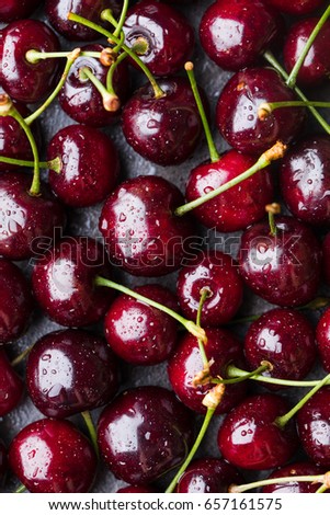 Fresh cherry on a table with water drops. Macro