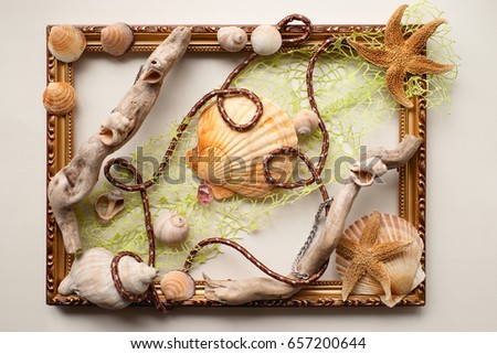 Frame made of cockleshells for the interior. The frame, decorated with seashells, starfish, dry branches for the interior. Marine themes in hand work. Designer product for interior decoration.