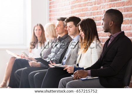 Group Of Diverse People Waiting For Job Interview In Office Royalty-Free Stock Photo #657215752