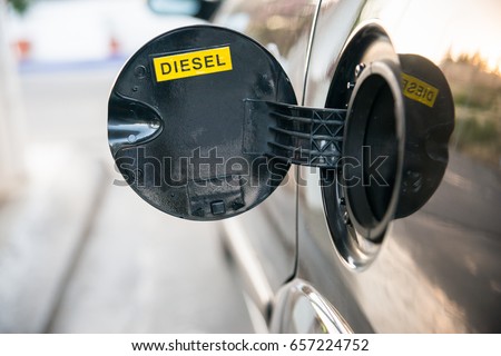 Opened car fuel tank with the word diesel. Copy space for text Royalty-Free Stock Photo #657224752