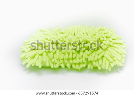 Isolated picture : Microfiber sponge for washing the car. Reflective green Color.