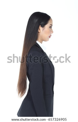 Business woman in black suit and trouser long hair, studio lighting white background isolated, portrait half body rear side view