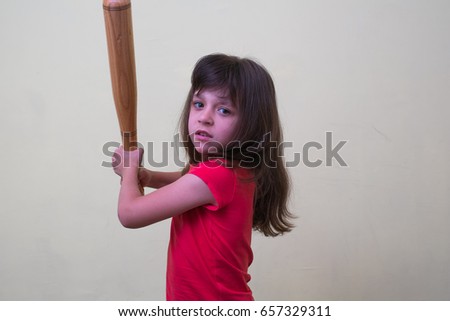 Girl child With a baseball bat