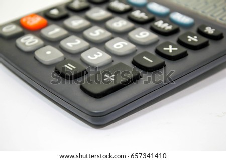Black digital calculator on white background, top view.Calculator isolated on white background, device for calculating numbers,calculators,calculator icon,calculator icon flat,calculator icons,calcula