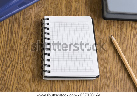 Notepad and stationery on the table