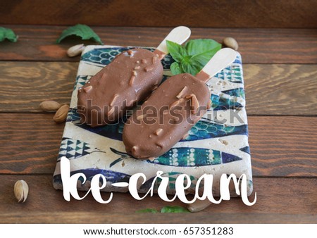 Chocolate ice cream with nuts on wooden background and ice-cream sign