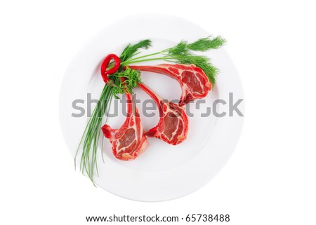 image of red veal ribs with greenery and pepper