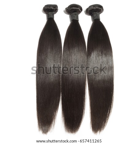 Straight black virgin remy human hair extensions bundles  Royalty-Free Stock Photo #657411265