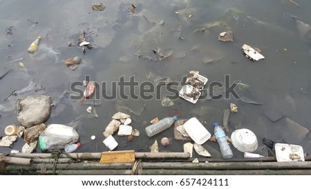 Careless and non responsibility behavior cause to environment problem as the picture shows many rubbishes were thrown  into the river