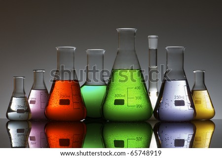 group of laboratory flasks containing liquid color Royalty-Free Stock Photo #65748919