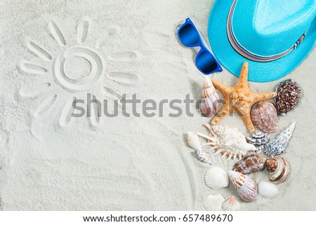 Sea background. Picture of a sun on a white sand. child`s clothes flat still top-view