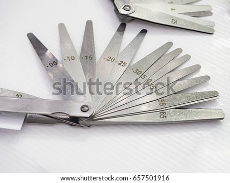 high accuracy feeler gauge for inspection gap of assembly part, tool for check clearance between part, industrial equipment for inspection and quality control Royalty-Free Stock Photo #657501916