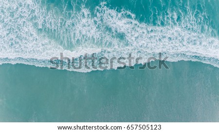 Aerial beach wave on tropical sea Royalty-Free Stock Photo #657505123