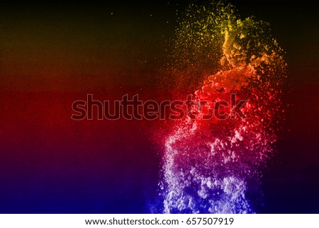Abstract powder splatted background,Freeze motion of color powder exploding/throwing color powder,color glitter texture on black background  